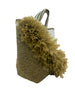 Woven handbag with ruffled beige fabric on a light background