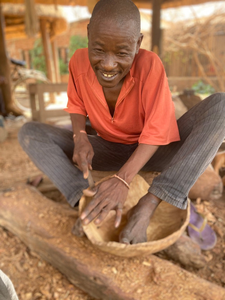 Zambian male wooden bowl carver 