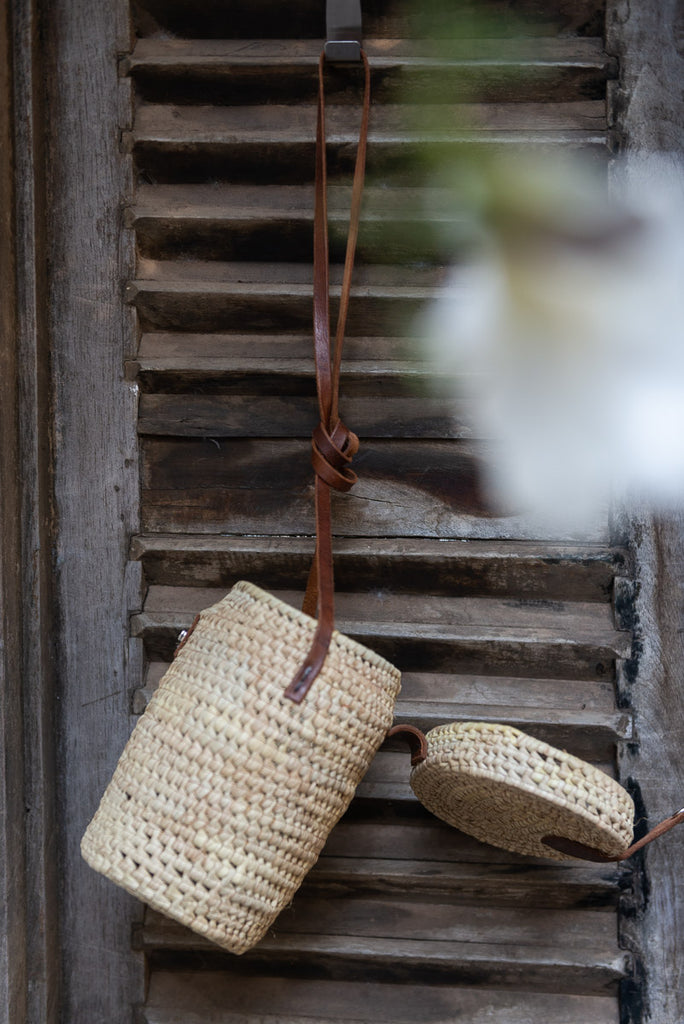 woven side view of a woven bag with flap open 